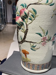 A Chinese famille rose molded 'nine peaches' vase, 19th C.